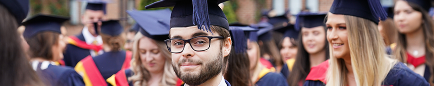 Graduate smiling into camera